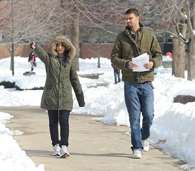 Students walking on campus in winter